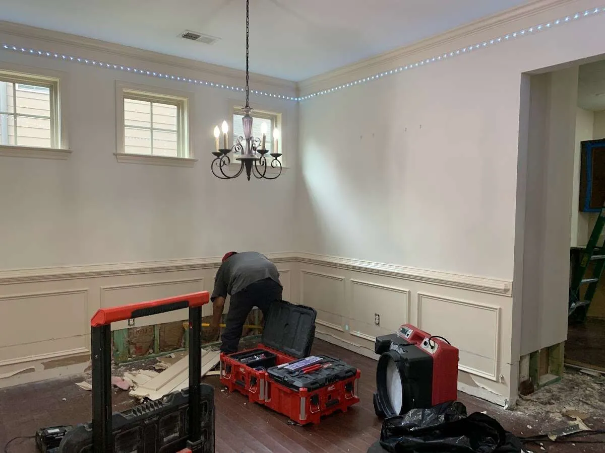Restoration technician with professional equipment in McLean